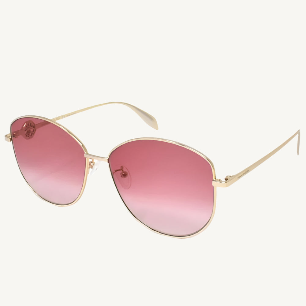 "Alexander McQueen AM0288S-004 women's round sunglasses with gold metal frame and red gradient lenses"