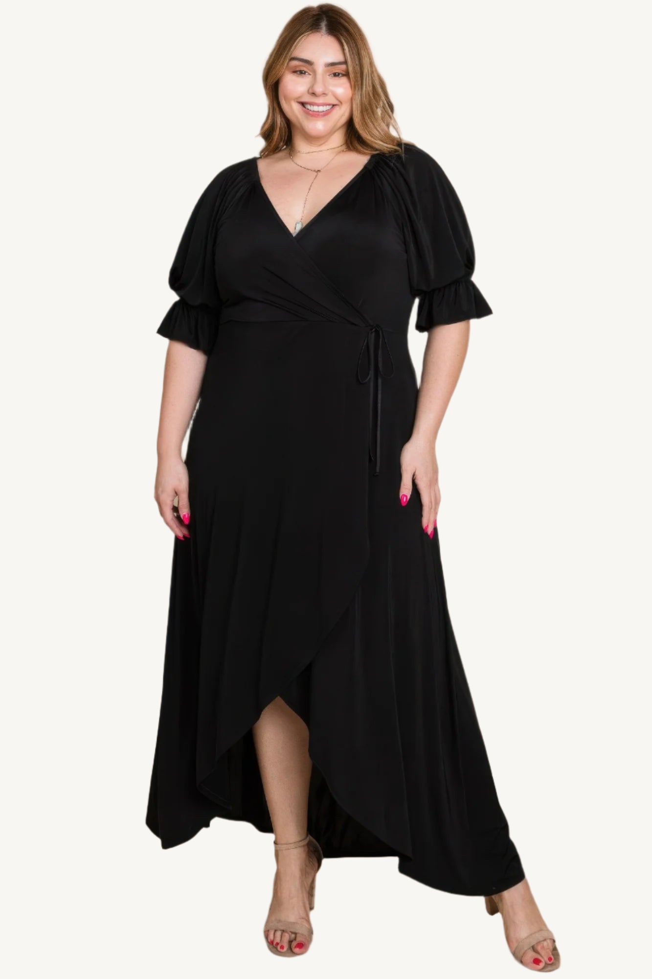 Plus-size solid color faux wrap maxi dress with Venezia fabric finish. Elegant silhouette offering style, comfort, and versatility for all occasions.