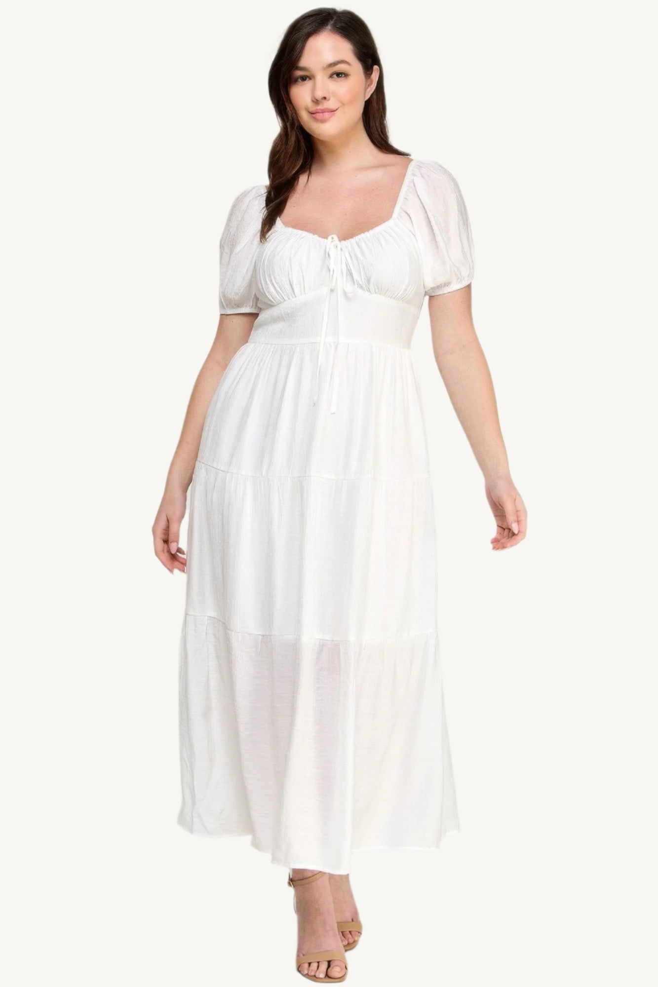 "White plus size tiered maxi dress with puff sleeves and front tie detail, crafted from lightweight polyester for a fresh and feminine look."