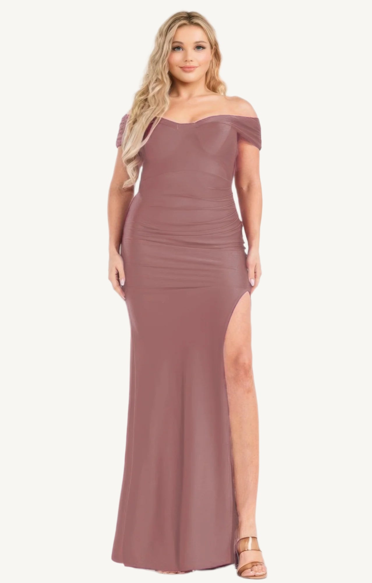 Plus-size off-shoulder satin maxi dress with draped cross-wrap neckline, shirred details, and floor-length silhouette. Made with stretch satin for elegant movement and comfort.