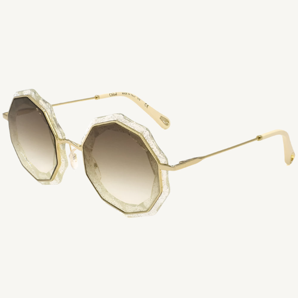 "Chloé women's sunglasses, model CE160S-859, featuring lame clear gold frame with round lenses and signature boho-luxury flair"