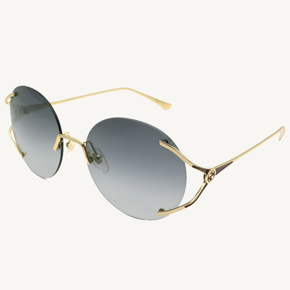 "Gucci GG0645S-001 women's rimless round sunglasses with gold metal frame and grey gradient lenses"
