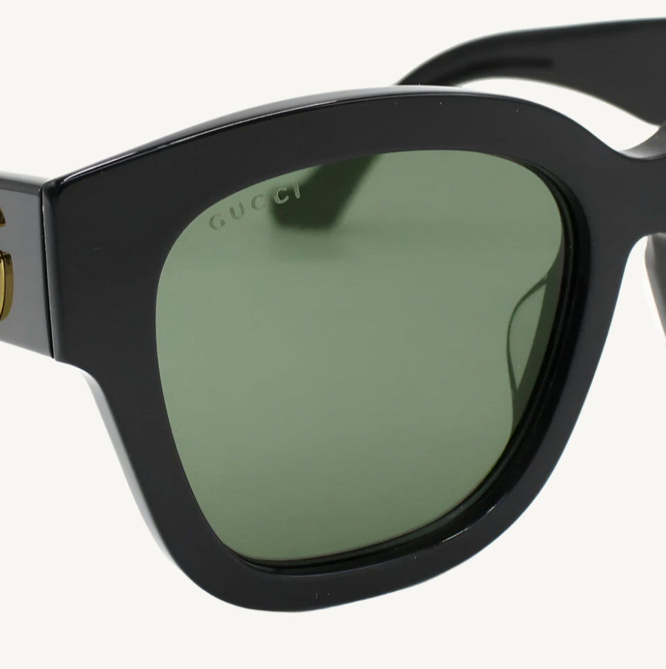 "Gucci women's black sunglasses, model GG1550SK-001, featuring bold square frame with iconic Gucci logo and timeless elegance"