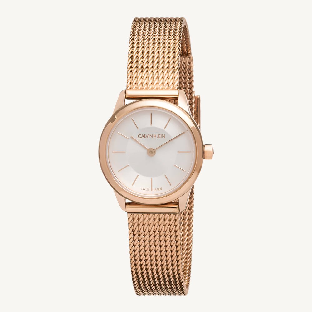 Elegant ladies’ watch in rose gold-tone stainless steel with silver dial, slim profile, quartz movement, and 3 bar water resistance by Calvin Klein.