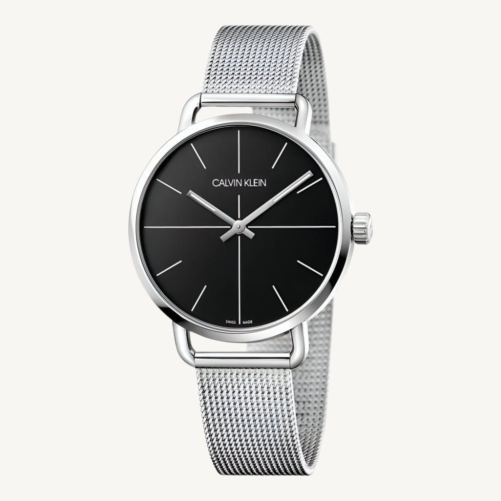 Sophisticated men’s watch by Calvin Klein featuring a polished silver-tone stainless steel case and strap, black dial, quartz movement, and 3 bar water resistance.