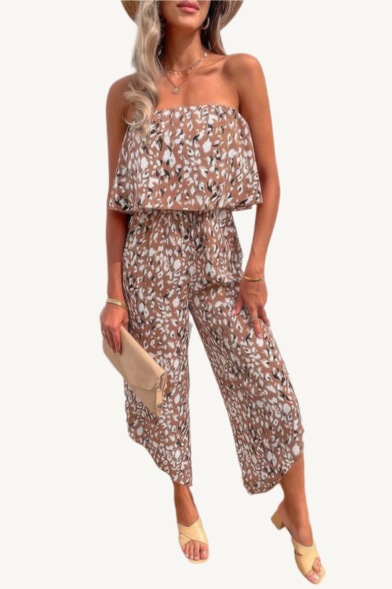 Allover print strapless tube jumpsuit with wide-leg silhouette, made from lightweight 100% polyester – bold, breezy, and perfect for warm-weather wear.