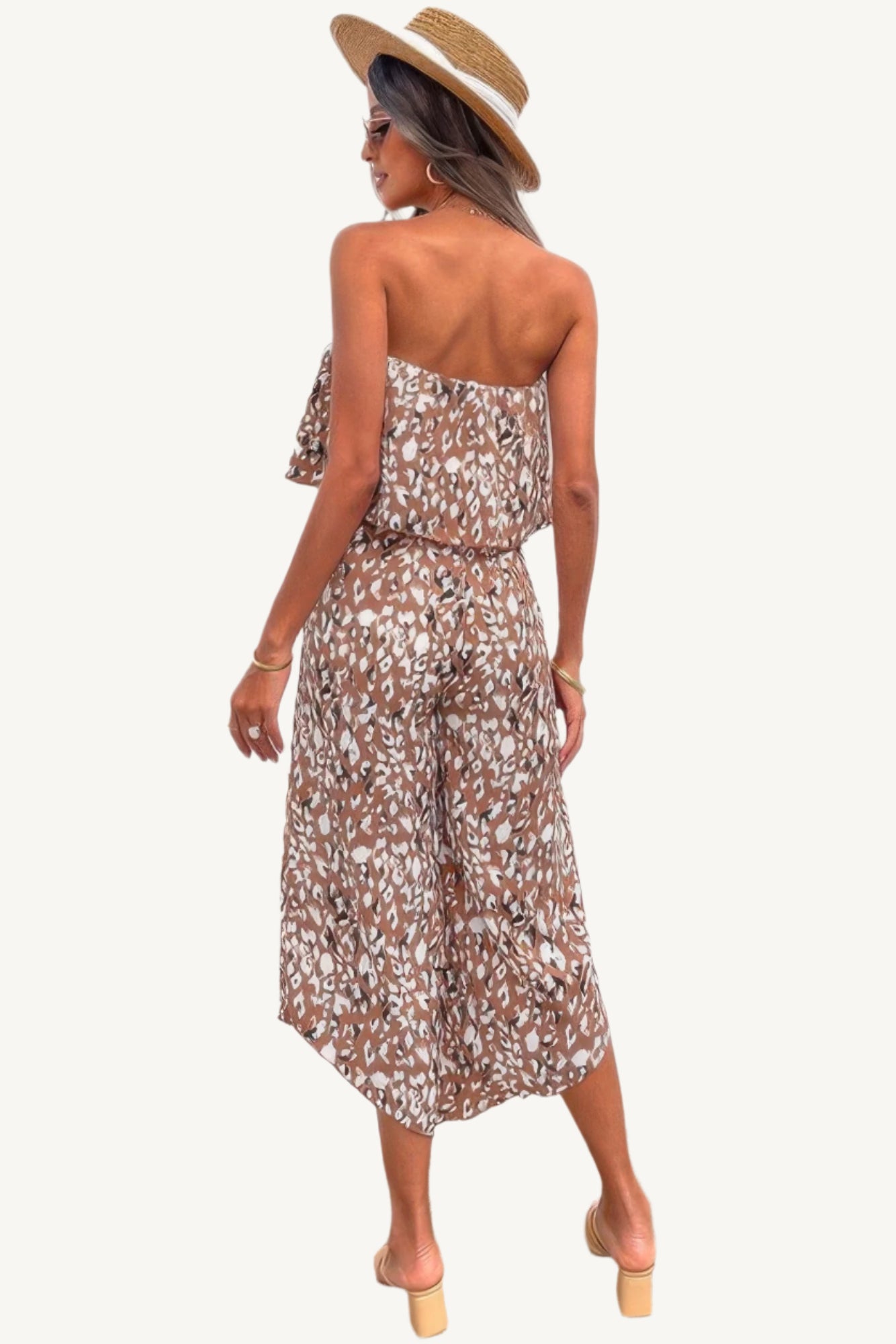 Allover print strapless tube jumpsuit with wide-leg silhouette, made from lightweight 100% polyester – bold, breezy, and perfect for warm-weather wear.