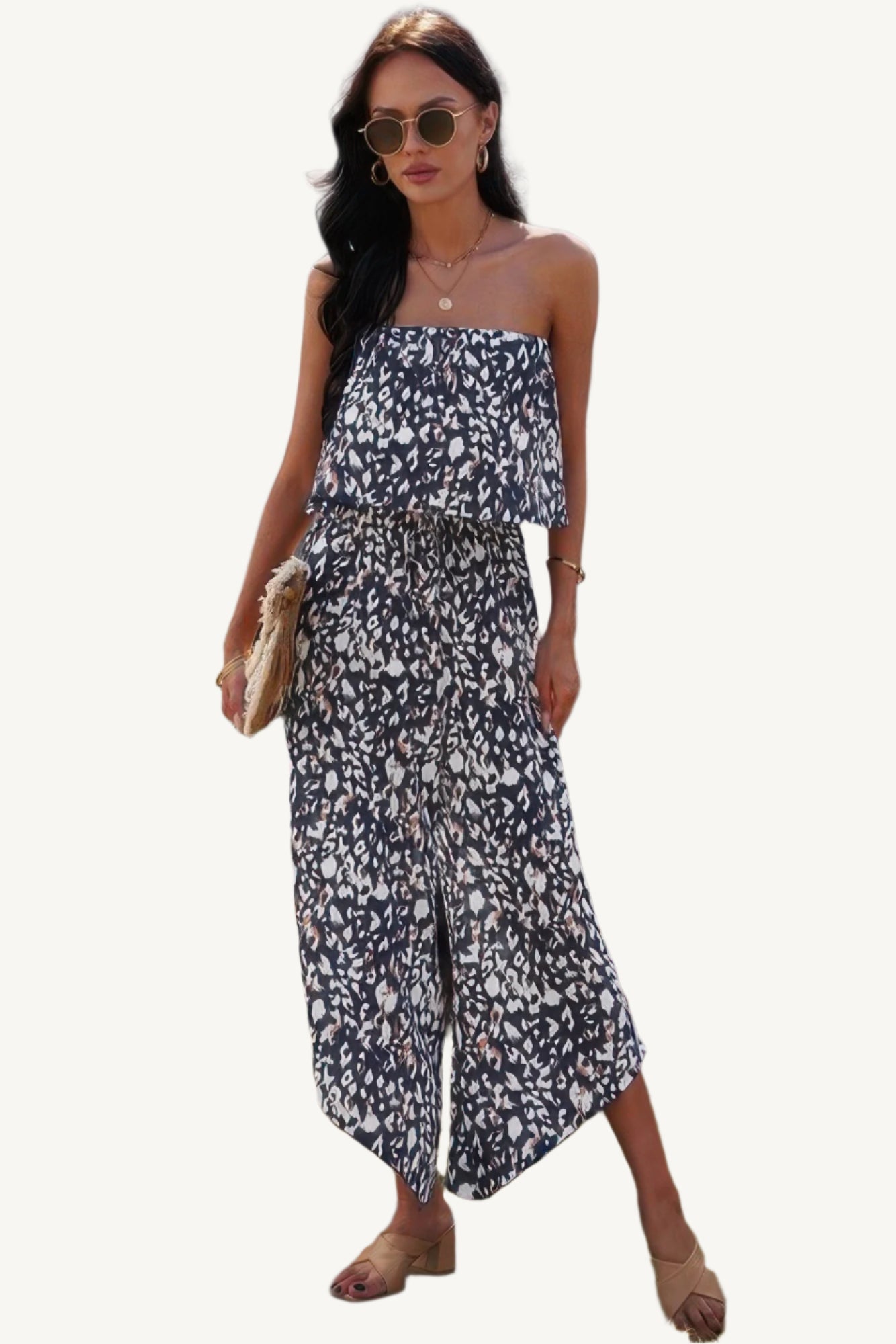 Allover print strapless tube jumpsuit with wide-leg silhouette, made from lightweight 100% polyester – bold, breezy, and perfect for warm-weather wear.