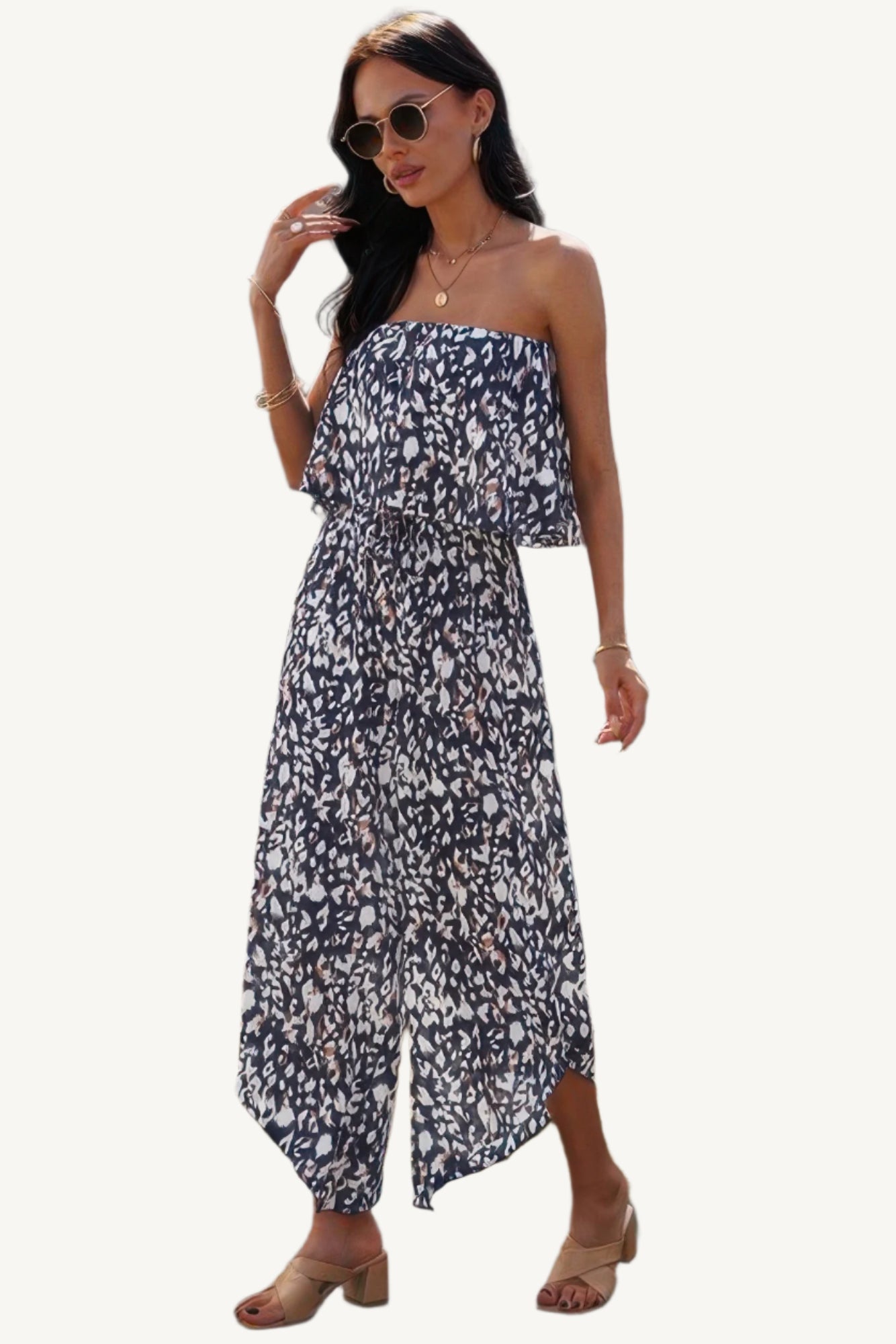 Allover print strapless tube jumpsuit with wide-leg silhouette, made from lightweight 100% polyester – bold, breezy, and perfect for warm-weather wear.