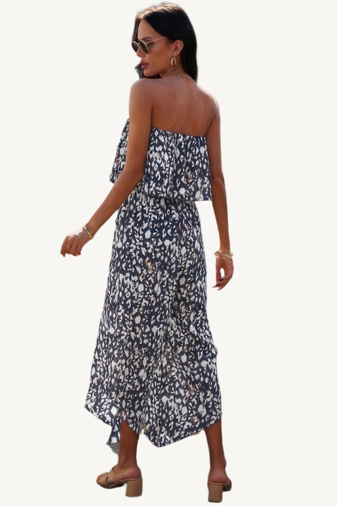 Allover print strapless tube jumpsuit with wide-leg silhouette, made from lightweight 100% polyester – bold, breezy, and perfect for warm-weather wear.