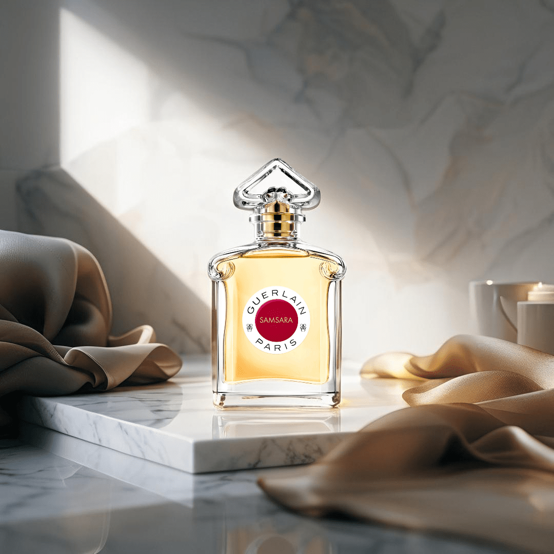 "Guerlain Samsara 2.5 oz Eau de Toilette Spray for Women – elegant ruby-red bottle with gold accents, featuring a fan-shaped cap, showcasing the iconic oriental floral fragrance."