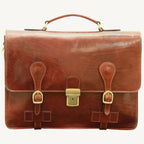 Handcrafted Italian brown leather briefcase made from full-grain calfskin, featuring classic buckle straps, flap closure, and interior compartments — elegant and functional for modern professionals.