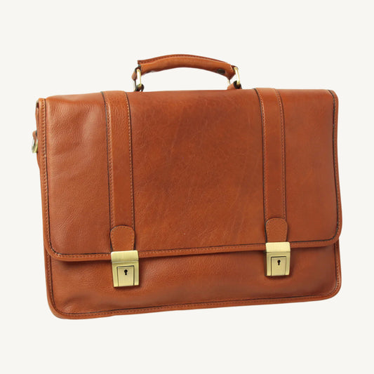 "Elegant 100% soft calfskin leather briefcase with polyester lining, featuring two exterior zip pockets, interior zip pocket, antique brass hardware, and adjustable padded shoulder strap."