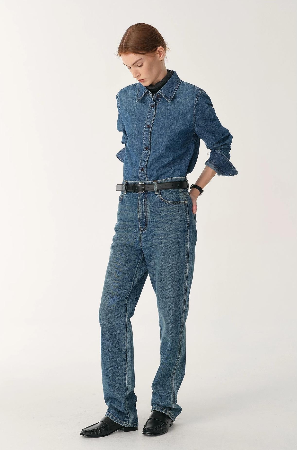 Person wearing a denim outfit on a white background