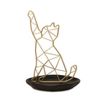 Gold geometric cat-shaped stand on a white background