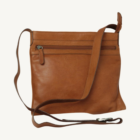Full-grain Italian leather hip bag for women, size 27x28x4 cm, weight 0.5 kg. Includes lining, inside and outside zip pockets, top zip closure, and adjustable leather shoulder strap. Ideal for carrying daily essentials with ease and style.