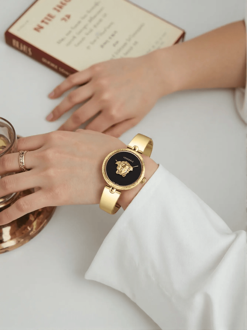 Versace VECO03122 Palazzo Empire ladies watch with 3D Medusa head on the dial, black case and strap, and bold gold-tone accents.
