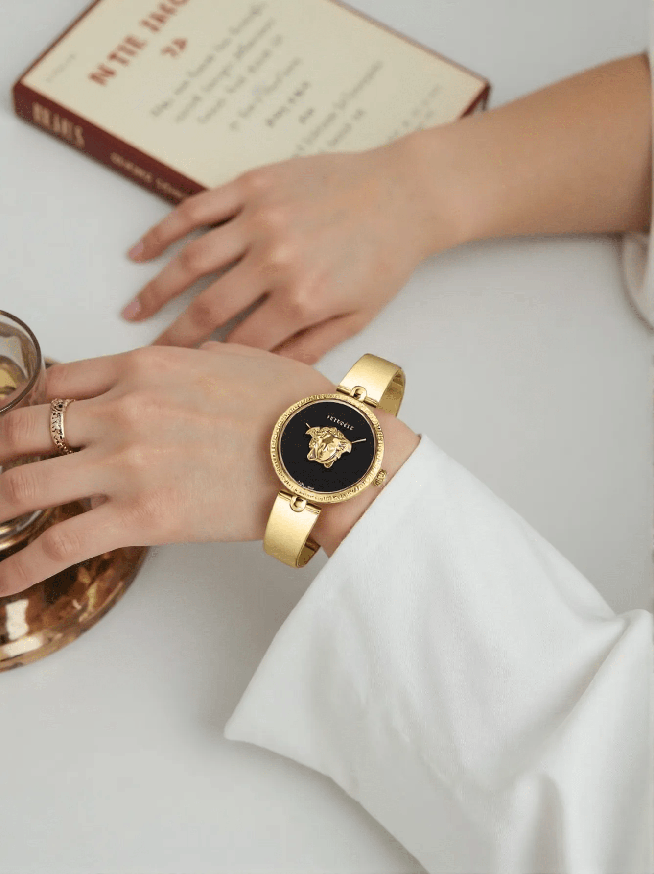 Versace VECO03122 Palazzo Empire ladies watch with 3D Medusa head on the dial, black case and strap, and bold gold-tone accents.