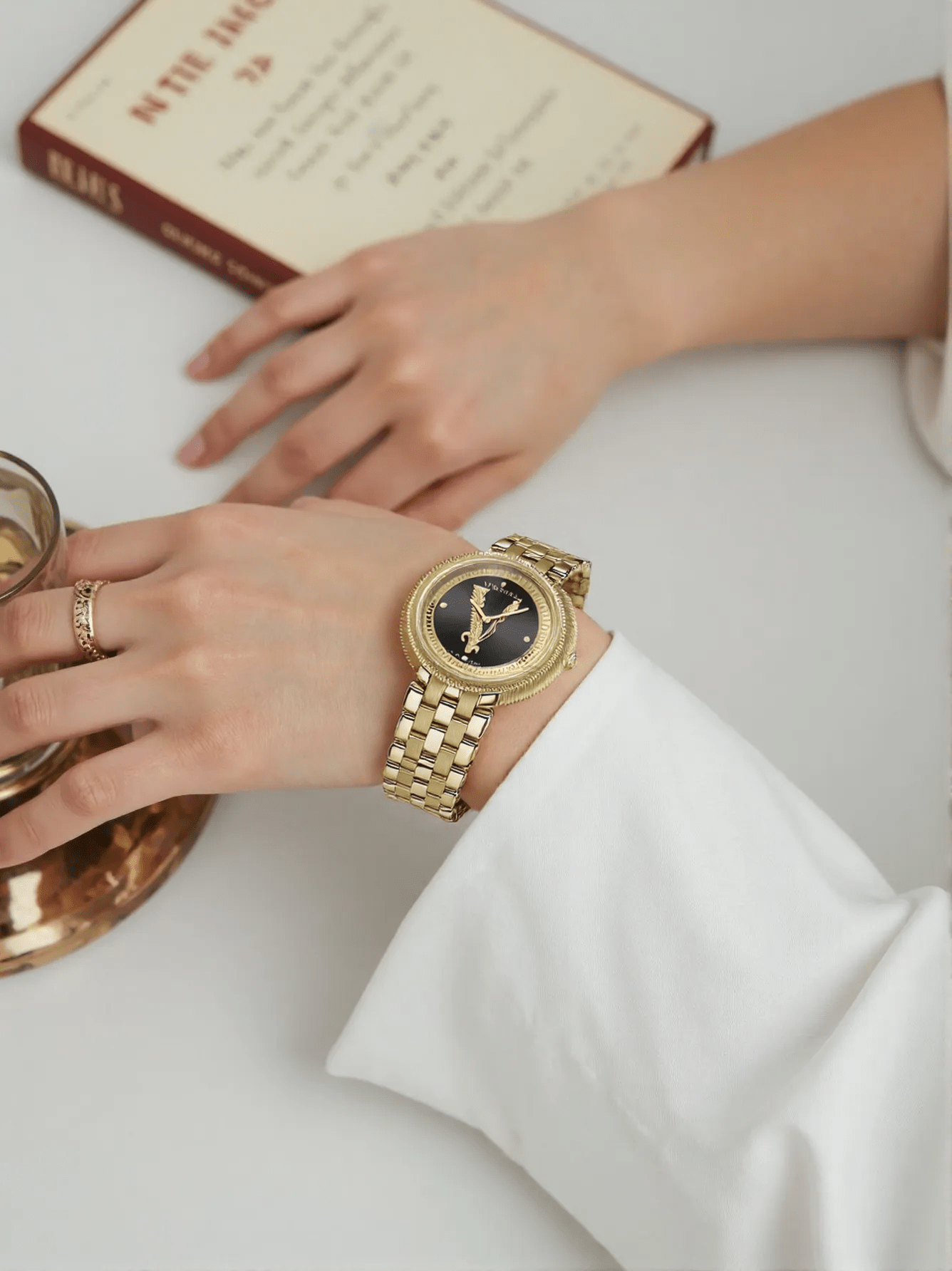 Versace VE2CA0723 New Lady ladies watch with polished gold-tone stainless steel case and bracelet, sleek black dial, sapphire glass – sophisticated Swiss quartz watch for women.