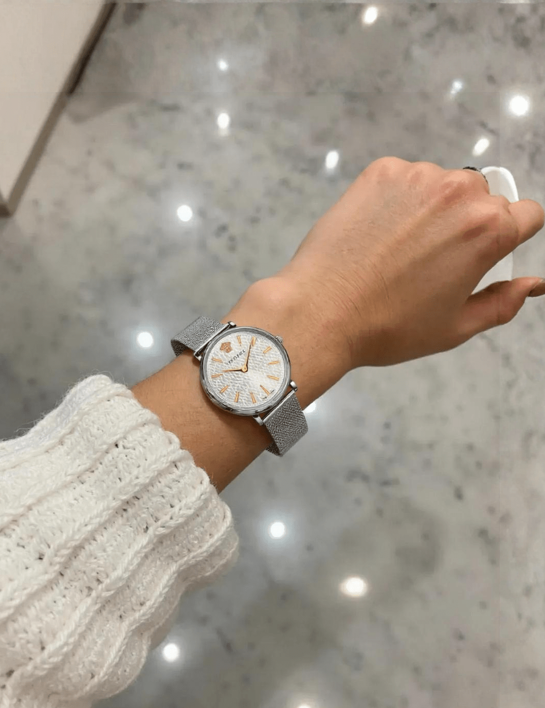 Stylish Versace VE8100519 V-Circle ladies watch featuring a sleek gold-tone case, white dial, and premium leather strap – luxury timepiece for women.