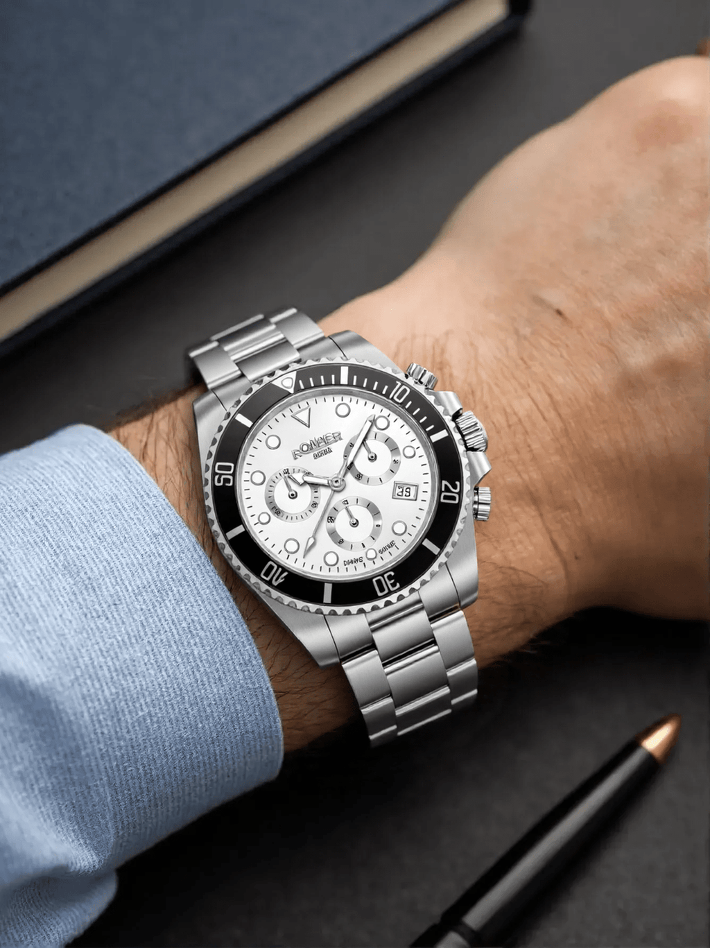 Roamer Deep Sea 100 men’s chronograph watch with silver dial, stainless steel strap, rotatable bezel, and stopwatch function, Swiss made.
