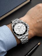 Roamer Deep Sea 100 men’s chronograph watch with silver dial, stainless steel strap, rotatable bezel, and stopwatch function, Swiss made.