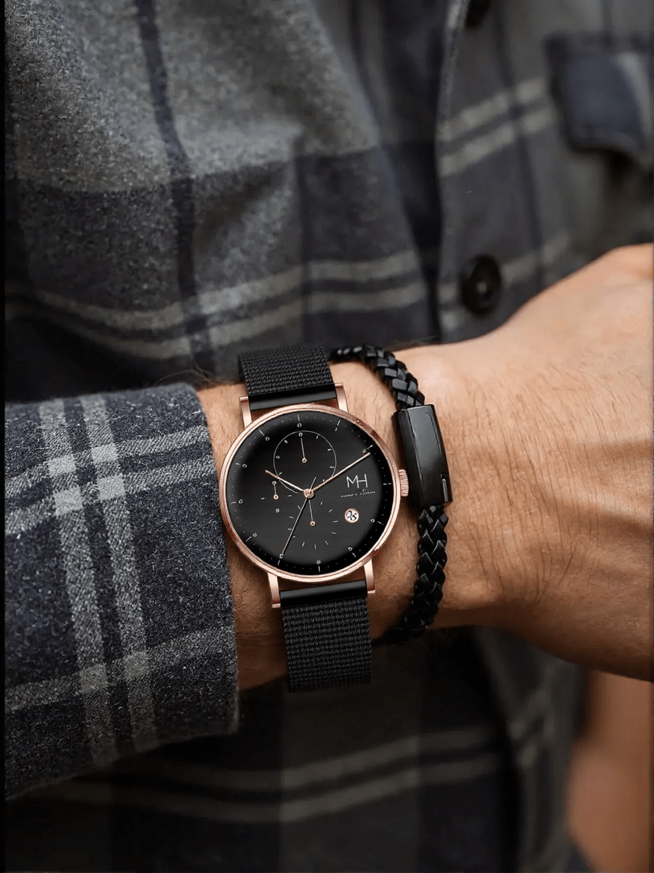 Marco Milano MH99199G1 men’s chronograph watch with polished rose gold-tone stainless steel case, black-coated bracelet, black dial, and stopwatch function – stylish Japanese quartz timepiece.