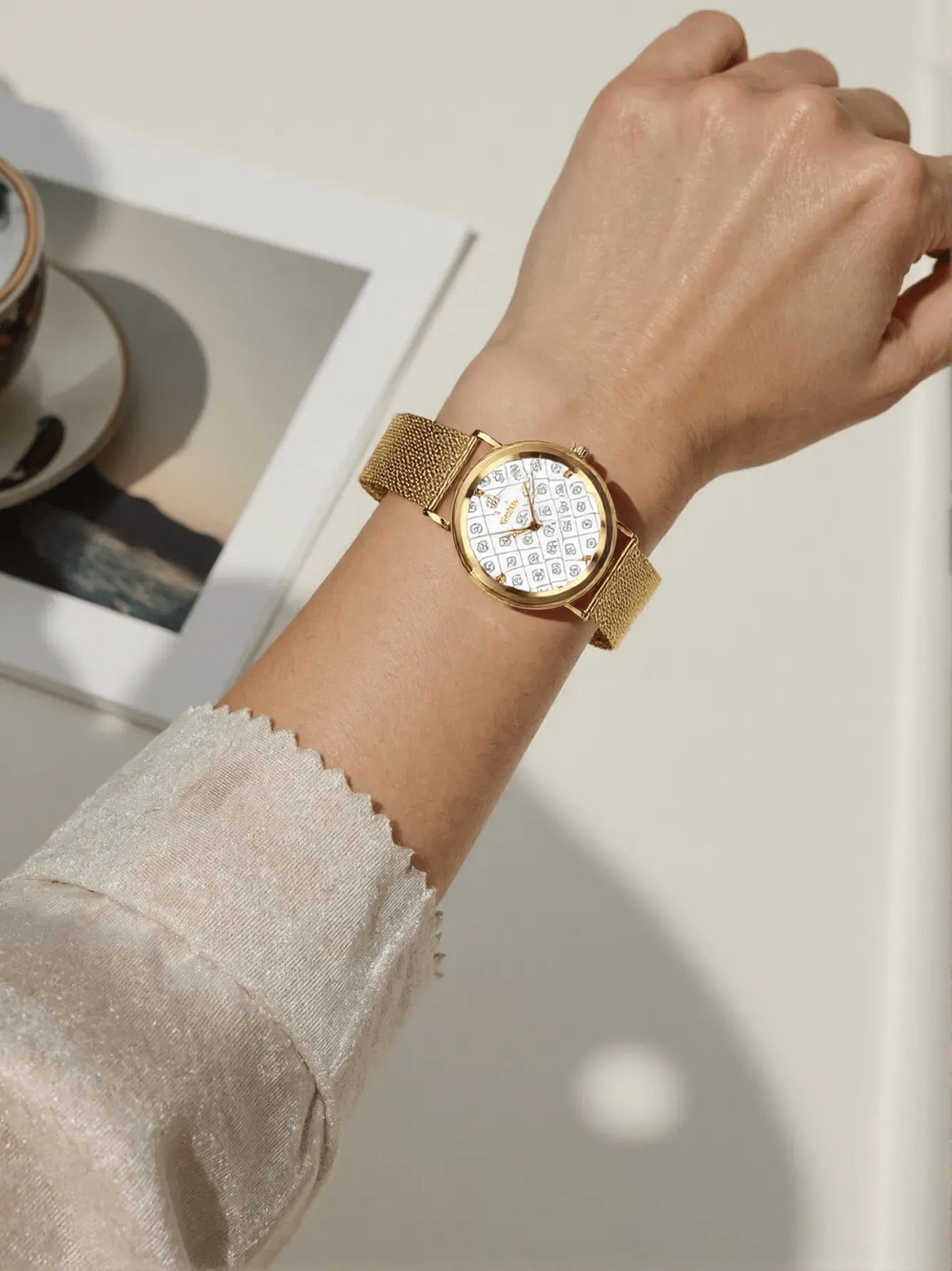 "Elegant Jowissa AnWy J6.256.M ladies Swiss watch with gold-tone stainless steel case and strap, white-grey stone-set dial, and sapphire glass."