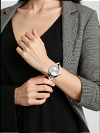 Stylish ladies’ silver-tone watch by Calvin Klein with a polished stainless steel case and strap, silver dial, slim profile, and quartz movement with 3 bar water resistance.