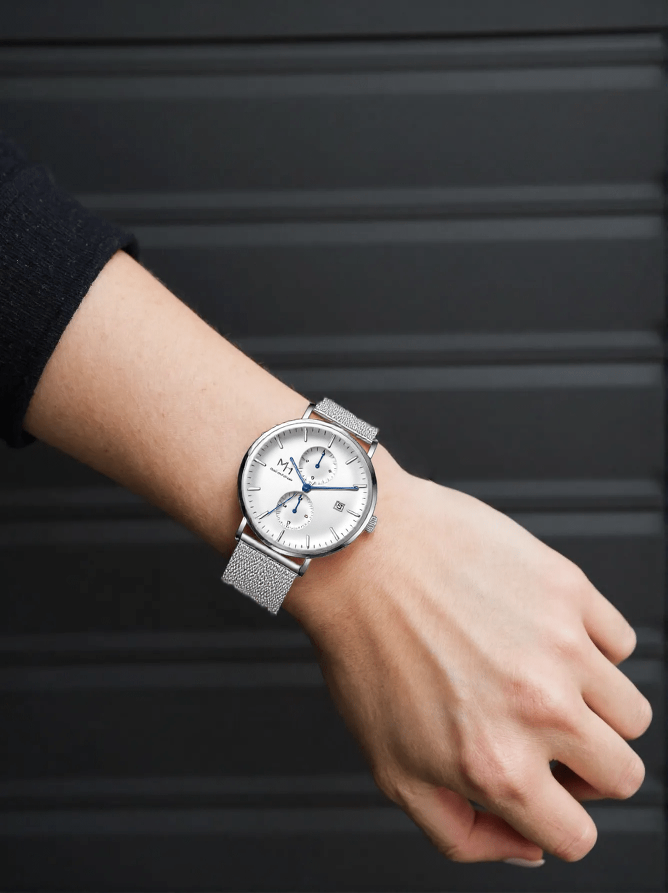 Marco Milano MH99240G1 men’s dualtimer watch with polished silver-tone stainless steel case and bracelet, silver dial, date display – modern Japanese quartz timepiece with dual time zones.