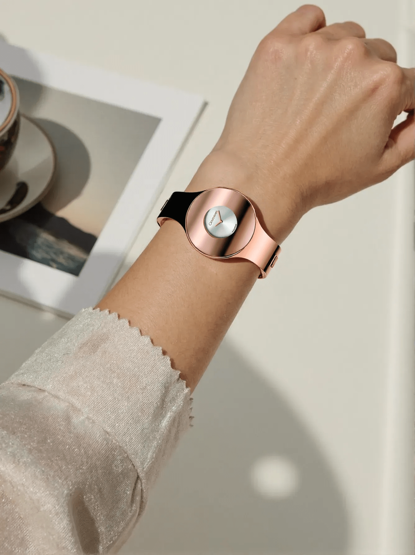 Elegant rose gold-tone ladies’ watch from Calvin Klein with polished stainless steel case and strap, silver dial, quartz movement, and 3 bar water resistance.