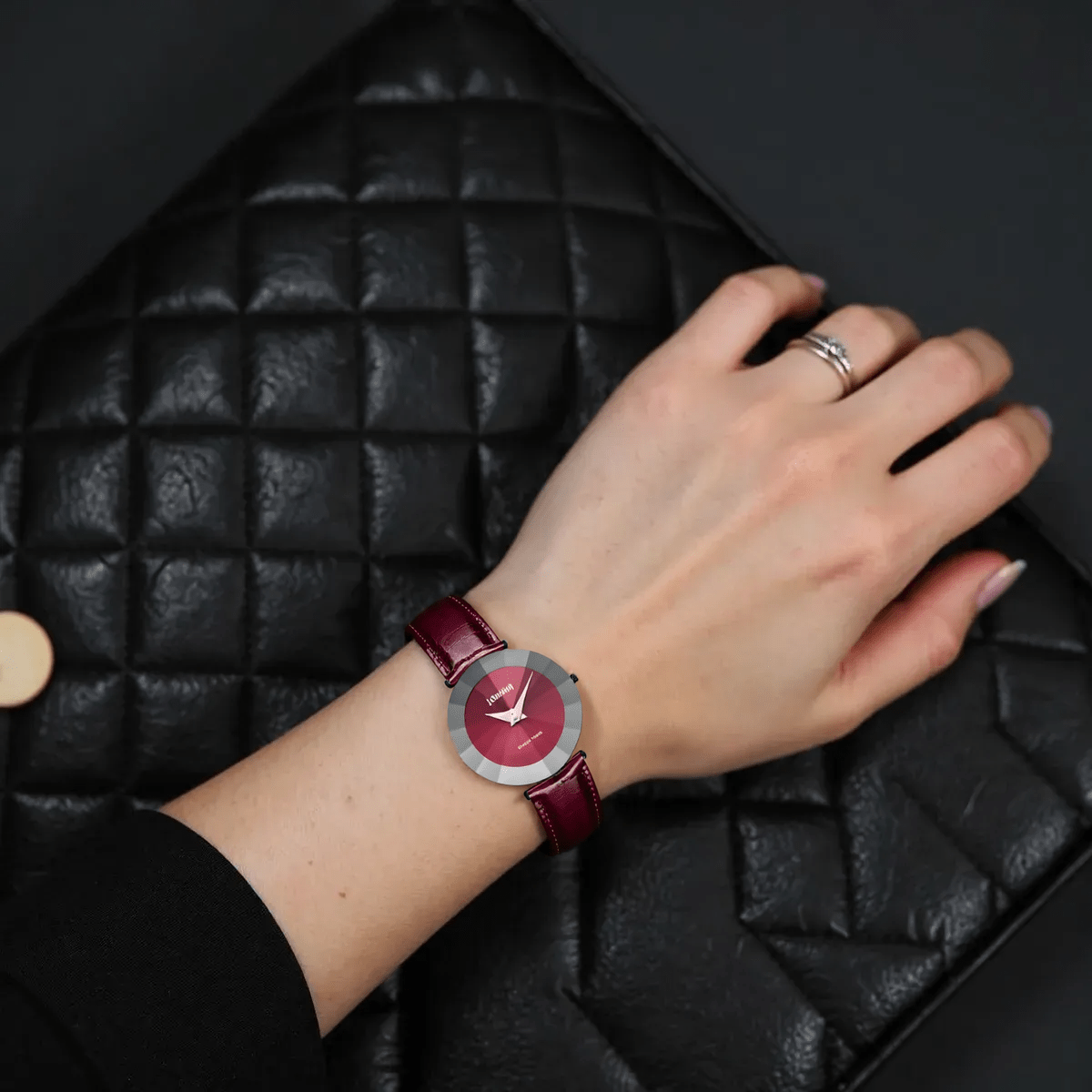 "Bold Jowissa Pyramid J5.309.XL ladies Swiss watch with black stainless steel case, red leather strap, red dial, and sapphire glass."