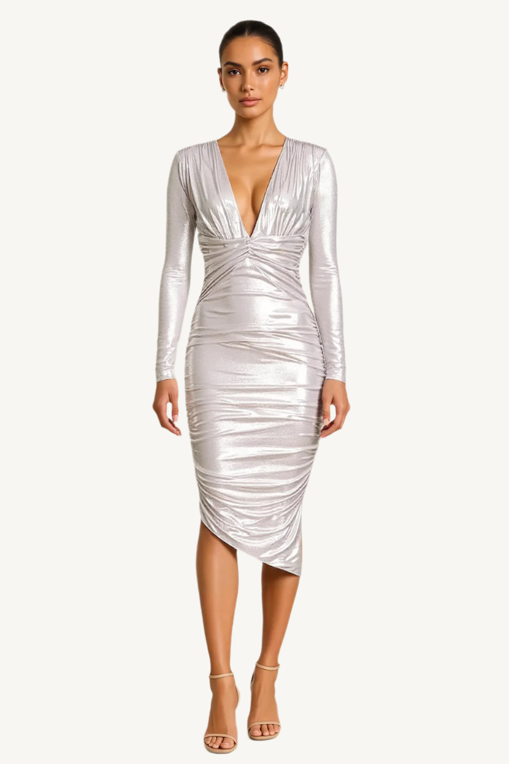 Silver dress worn by a model on a beige background