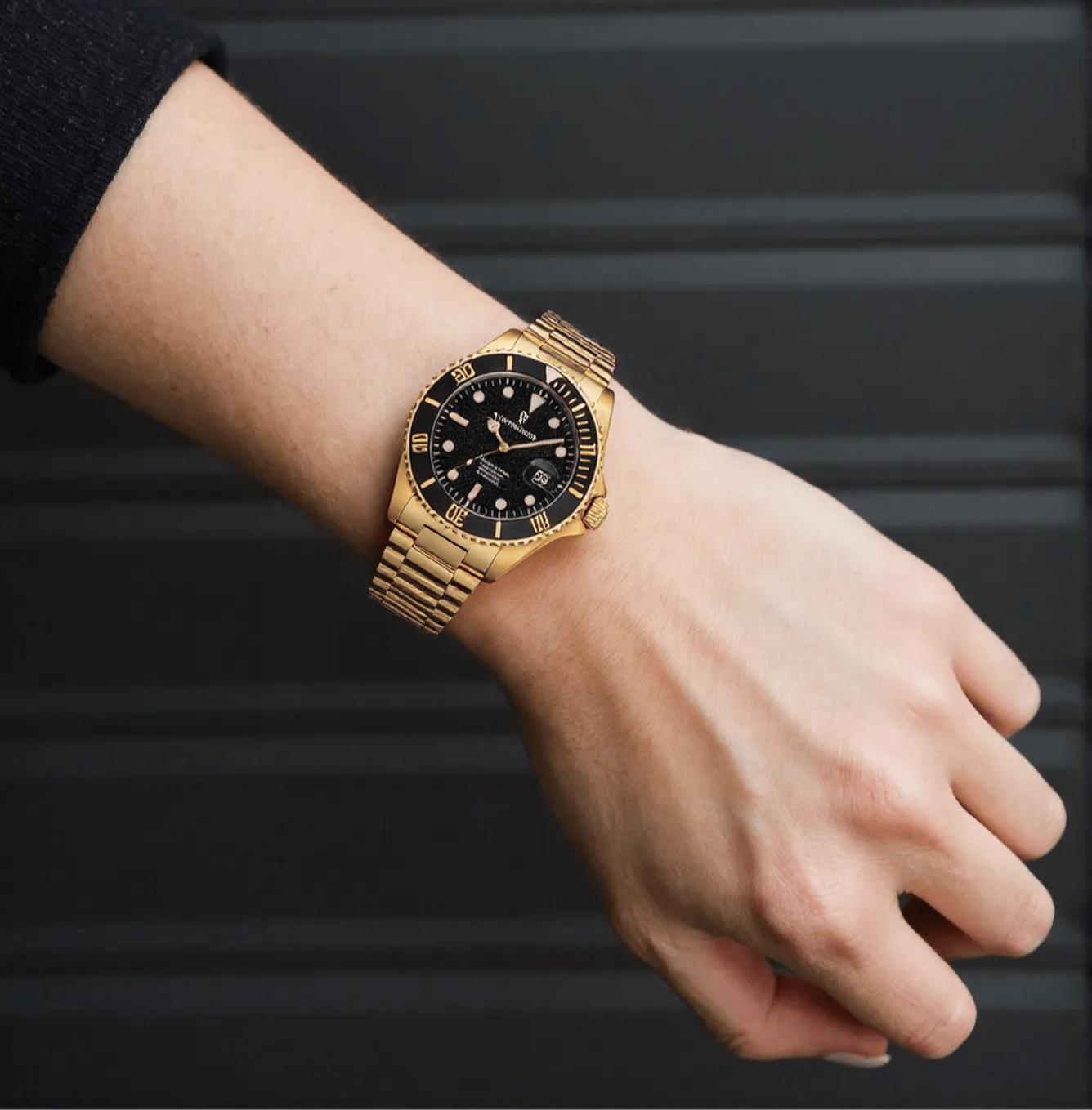 Revue Thommen Diver men’s automatic watch with black dial, gold-tone stainless steel strap, luminous hands, and 300m water resistance, Swiss made.