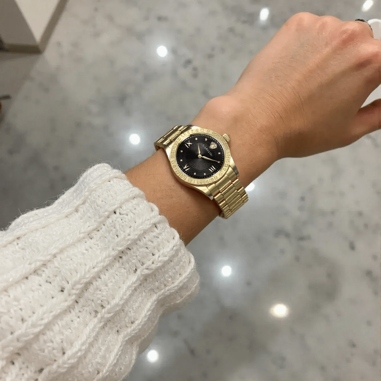 Versace VE2K00721 Greca ladies watch with polished gold-tone stainless steel case and bracelet, black dial, sapphire glass – luxury Swiss quartz timepiece for women.
