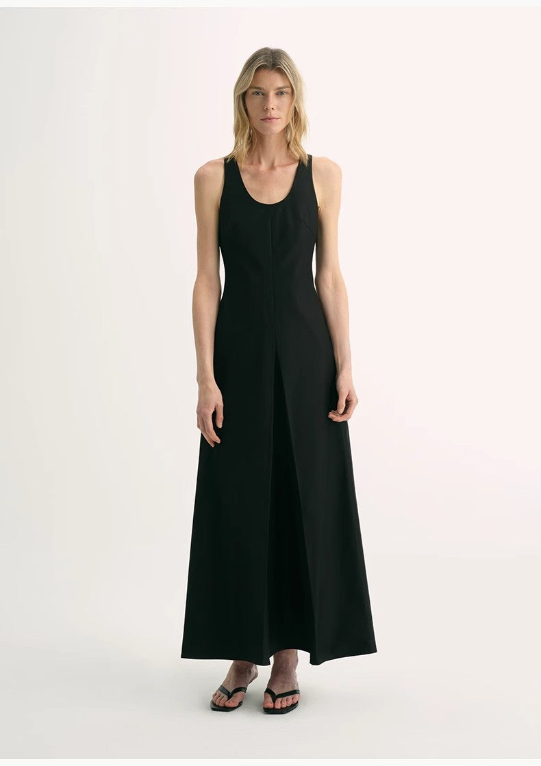 Woman wearing a black sleeveless dress on a white background