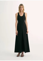 Woman wearing a black sleeveless dress on a white background