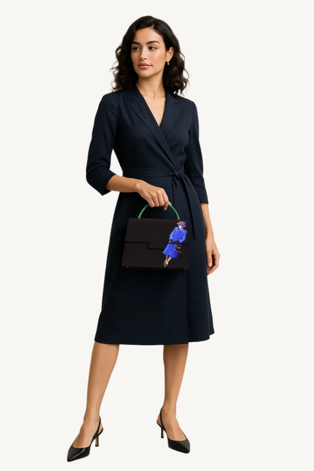 Woman in a navy wrap dress holding a black handbag with a blue design on a beige background