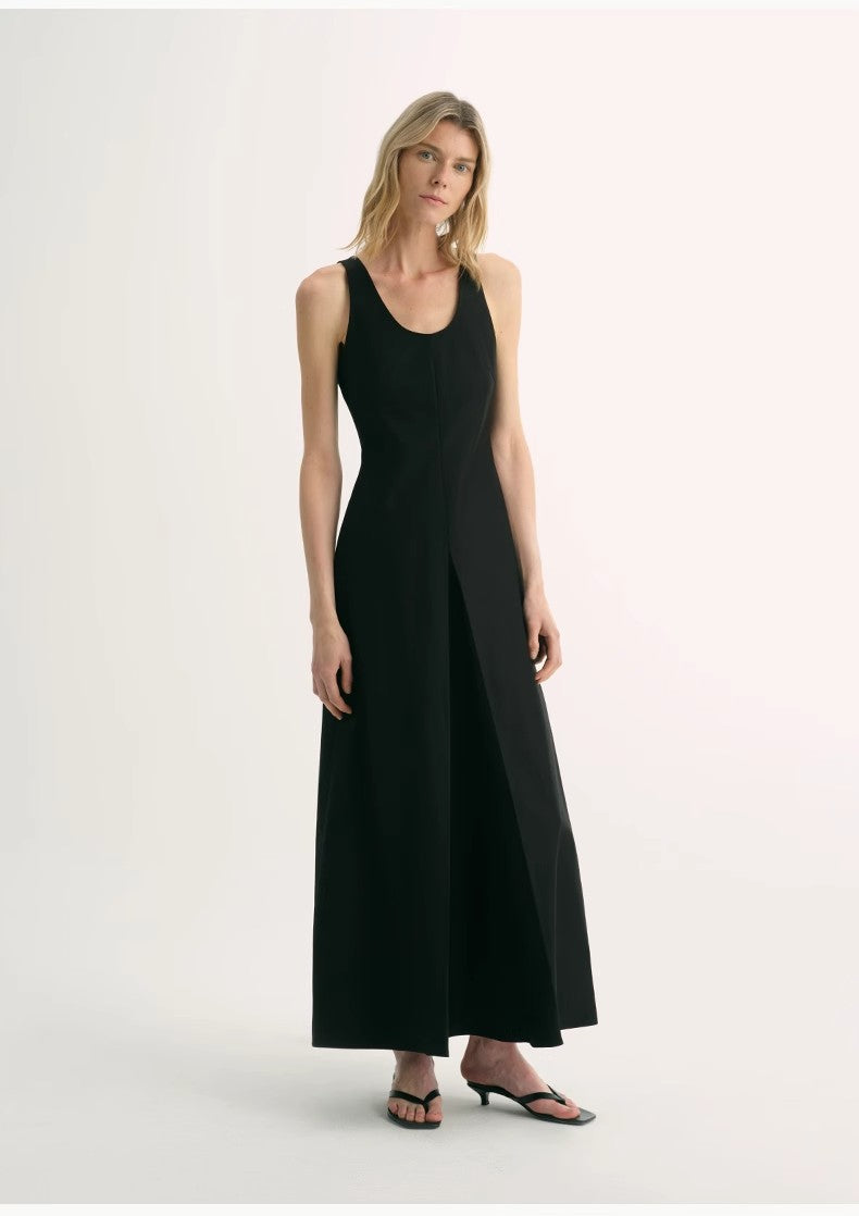 Woman wearing a black sleeveless dress on a white background
