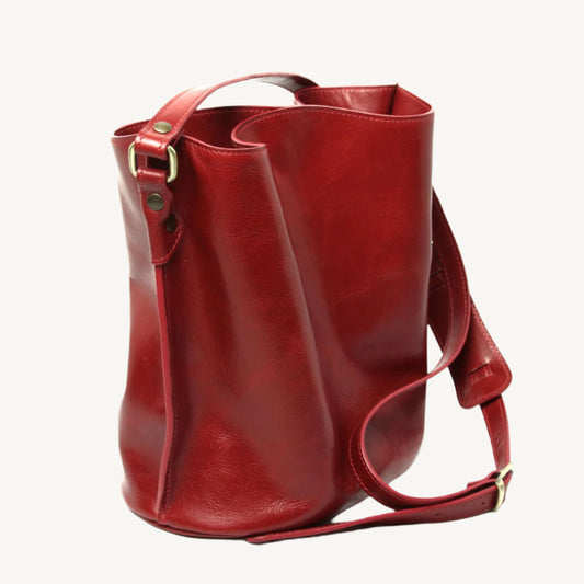 "Red full-grain leather shoulder bag with adjustable strap, bold and elegant design"