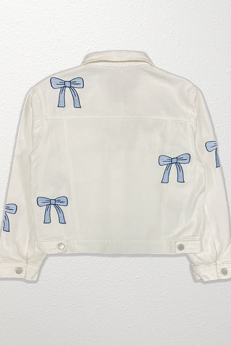 White denim jacket with blue bow patterns on a white background