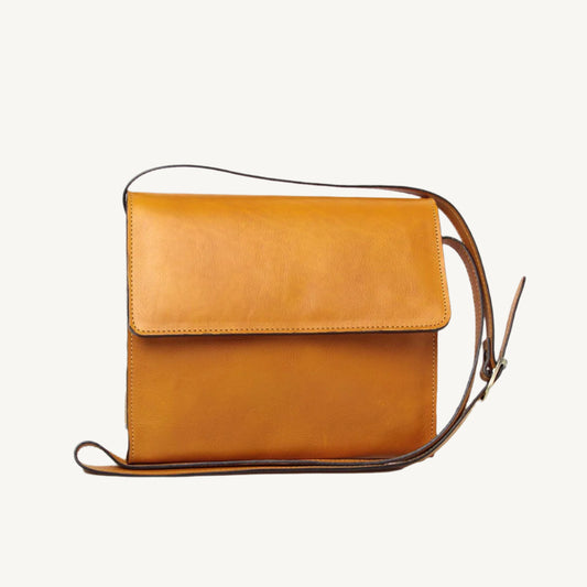 "100% full-grain calfskin leather shoulder bag with three compartments, zippered pocket on the rear, and adjustable fixed strap"