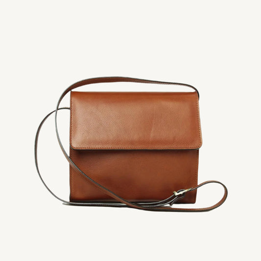 "Elegant full-grain calfskin leather shoulder bag with three compartments, rear zip pocket, and adjustable shoulder strap"