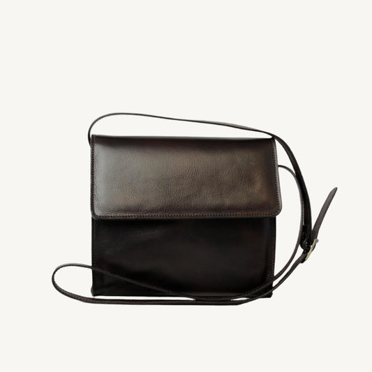 "Full-grain calfskin leather shoulder bag with three compartments, zippered rear pocket, and adjustable shoulder strap"