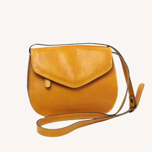 Elegant full-grain calfskin leather shoulder bag with zippered front and back pockets, three compartments, and adjustable strap.