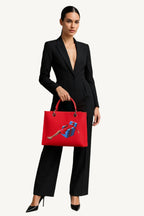  Hand-painted handbag with artwork on both front and back, featuring a red cotton logoed interior with four functional pockets, nickel-colored hooks and internal zip, double red leather handle, and a matching hand-painted leather and canvas shoulder strap that reflects the main painting’s theme, secured with a magnetic button closure.