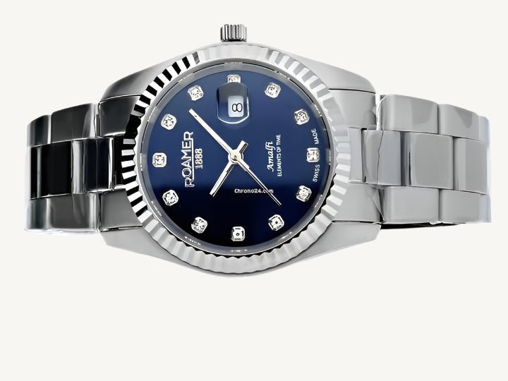 Elegant Roamer Amalfi ladies watch with silver stainless steel strap and blue stone-set dial, Swiss made.