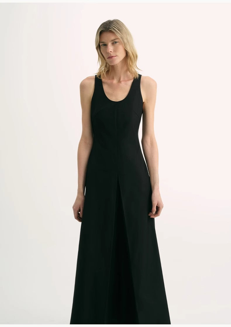 Woman wearing a black sleeveless dress on a white background
