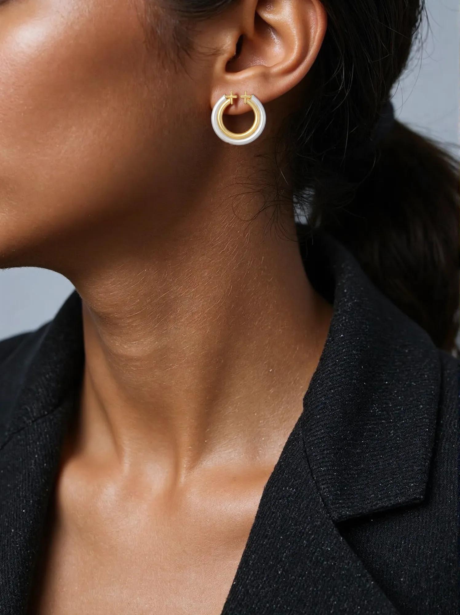 14k two-tone gold double round hoop earrings in yellow and white gold.