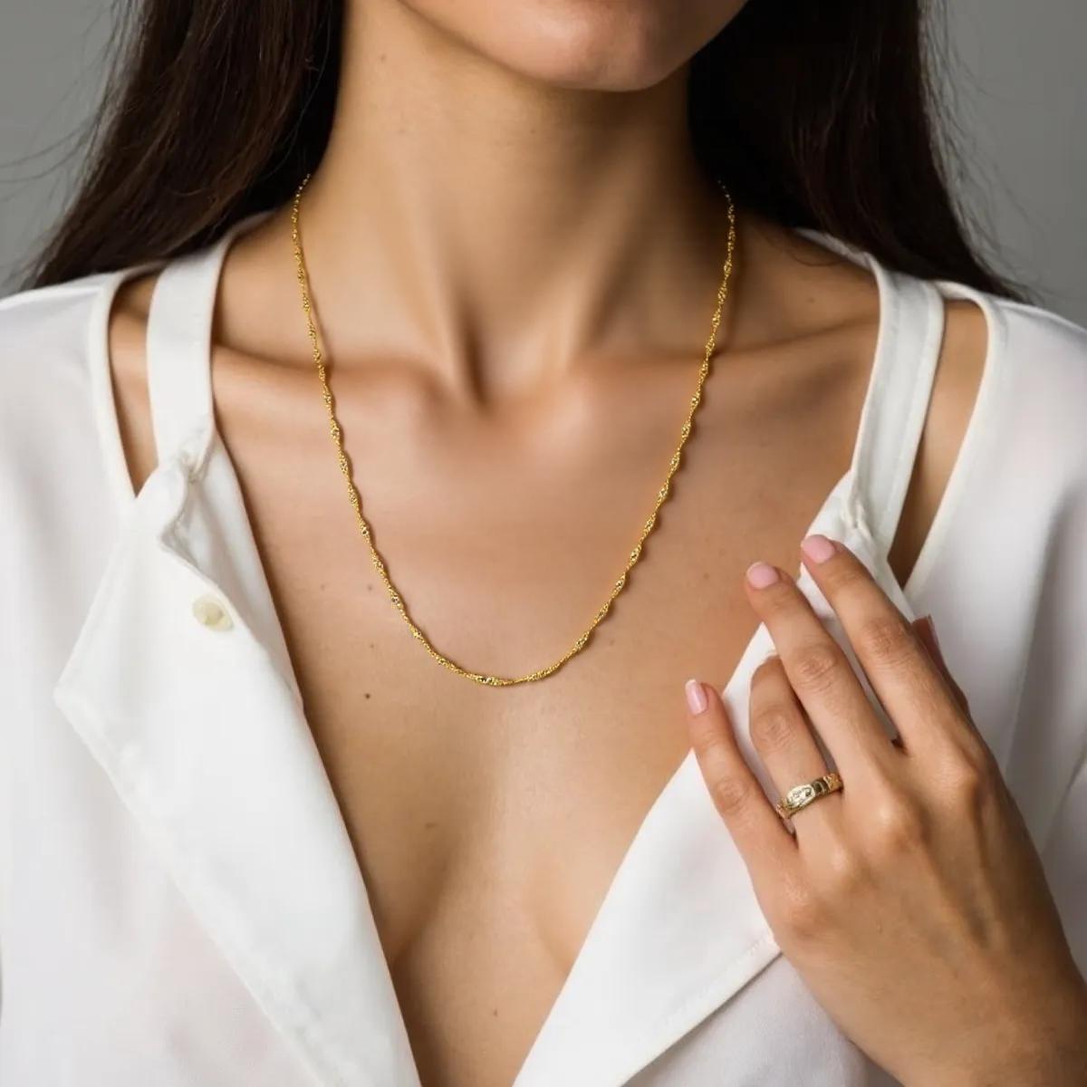 "Elegant 10k yellow gold Singapore chain, 1.50 mm wide, with a delicate twisted design and polished finish."